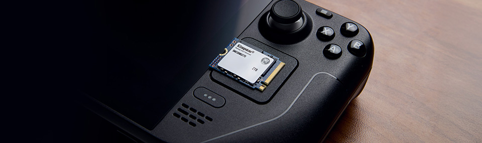 Opening a Steam Deck is easier than you may think and replacing its SSD almost as simple. A Steam Deck on a table outside by a lawn.