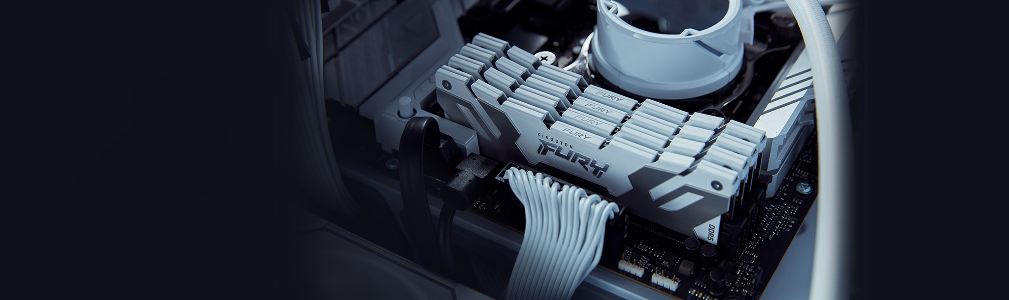 White Kingston FURY Renegade DDR5 memory modules installed inside a clean, all-white computer build.